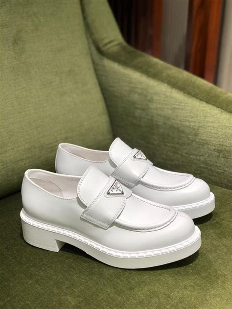 white prada loafers